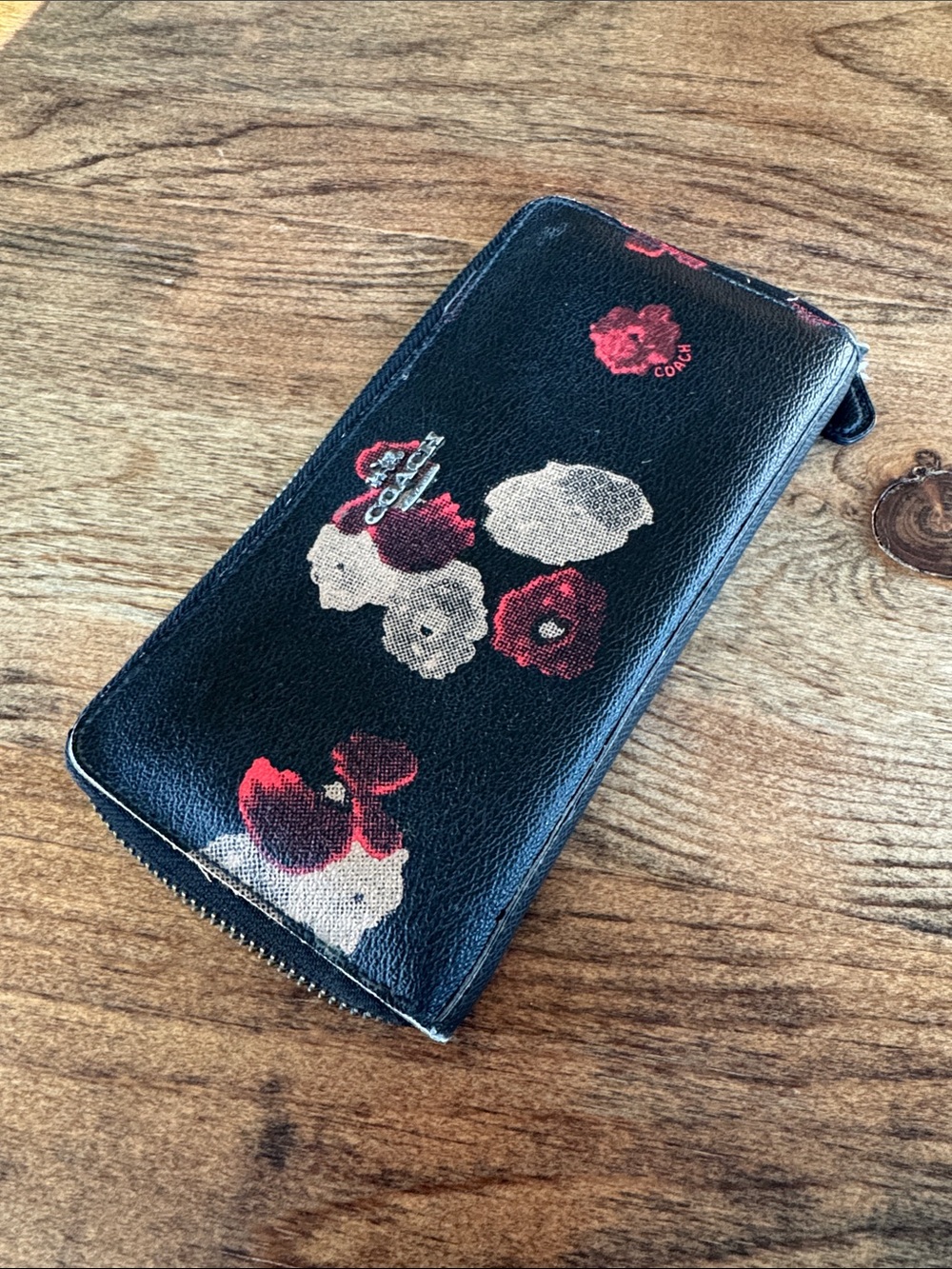 Coach Black Leather Zip Wallet with Red and Cream Floral Motif